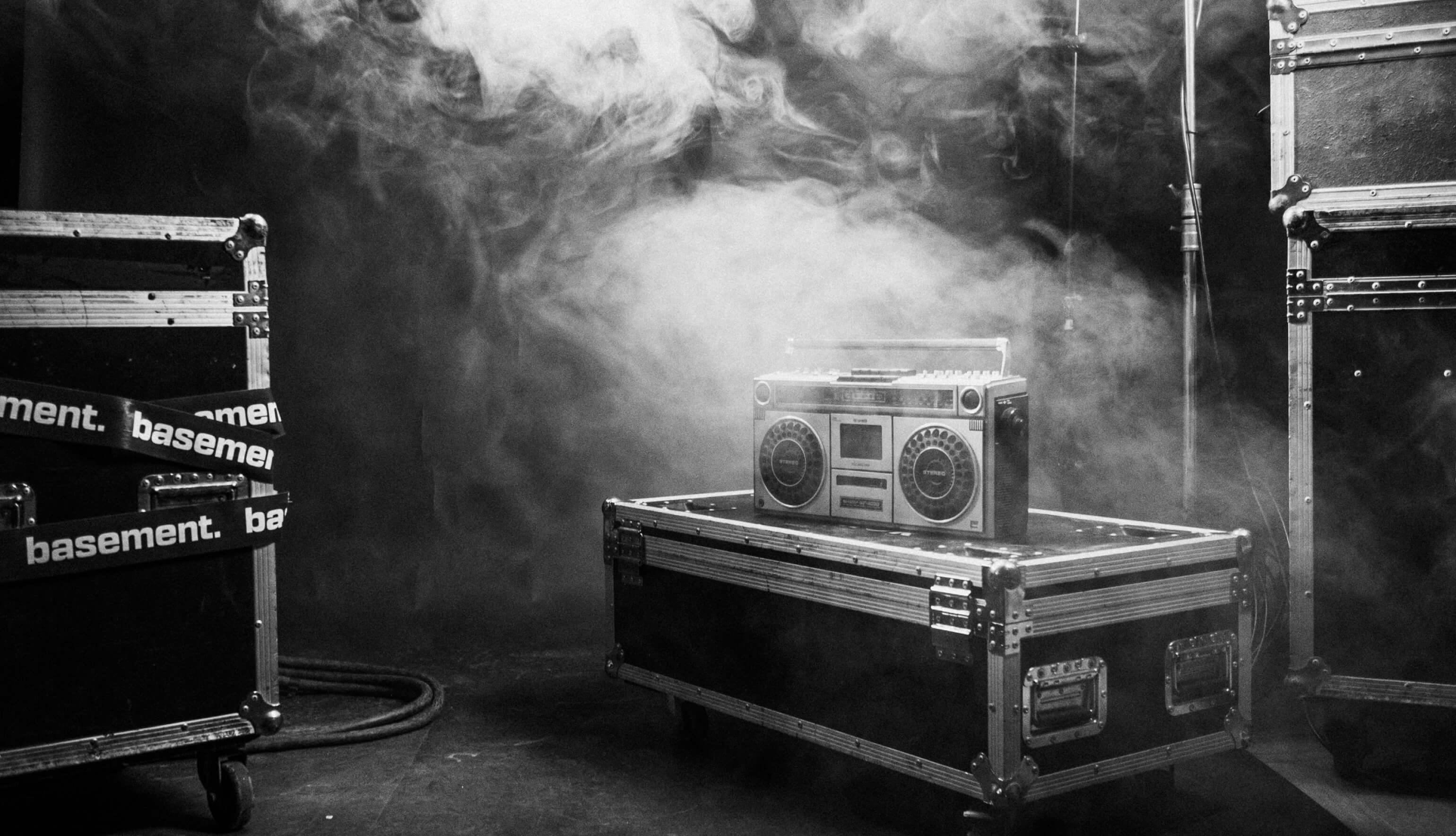 an old boombox with a smokey background